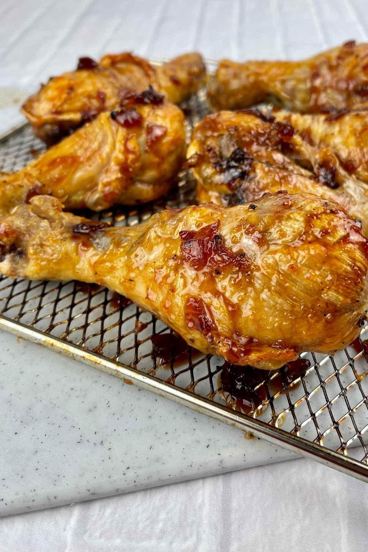 Glazed chicken drumsticks.