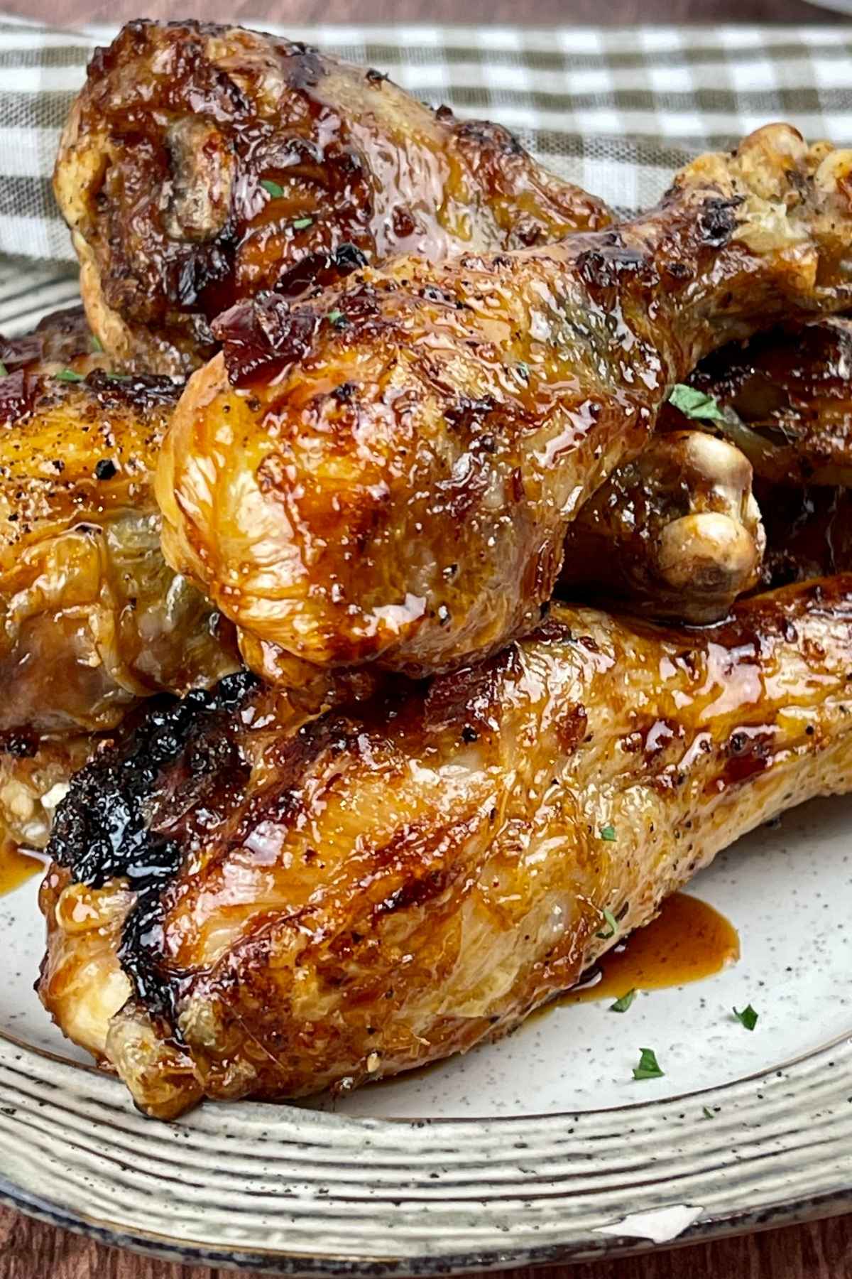 Upclose image of air fryer chicken legs with glaze.