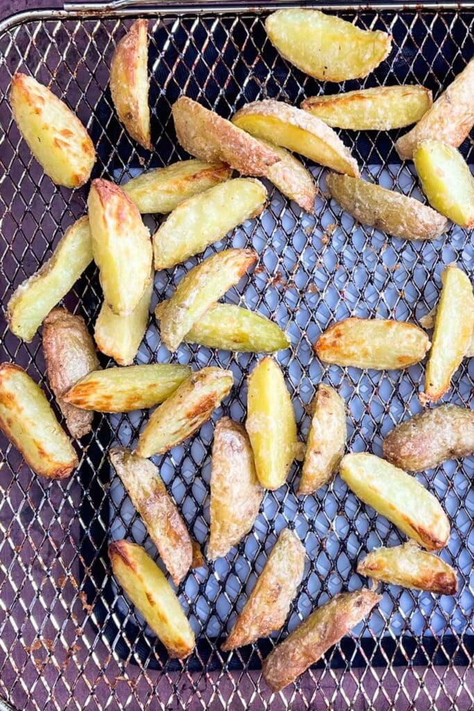 Overhead image of air fryer fingerling potatoes on an air fryer tray.