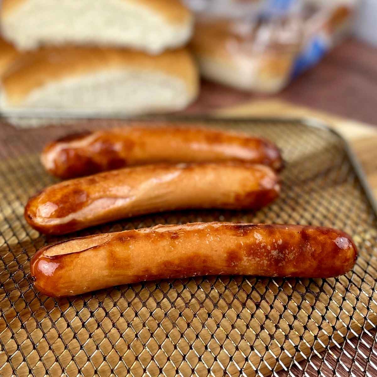 Air Fried Hot Dogs on air fryer rack.