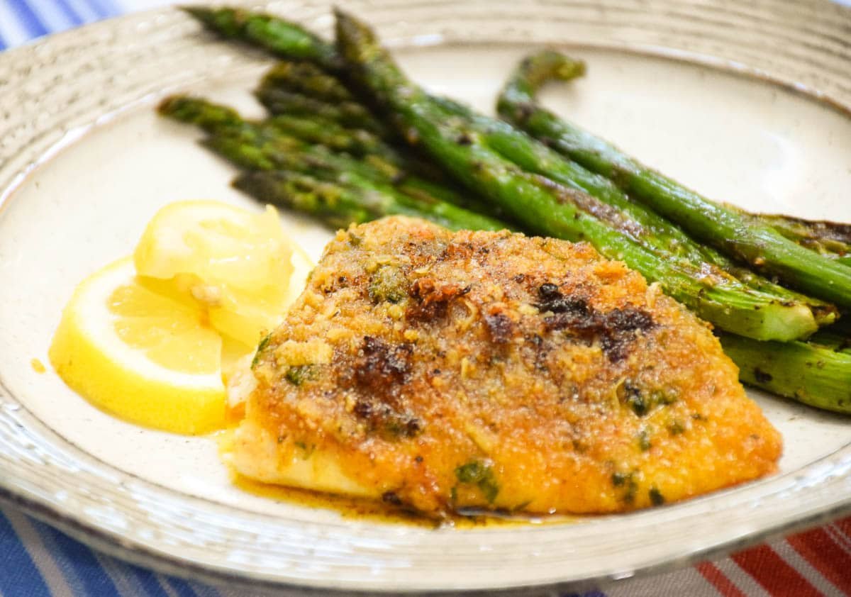 Baked Red Snapper Fillets with Garlic with a side of asparagus.