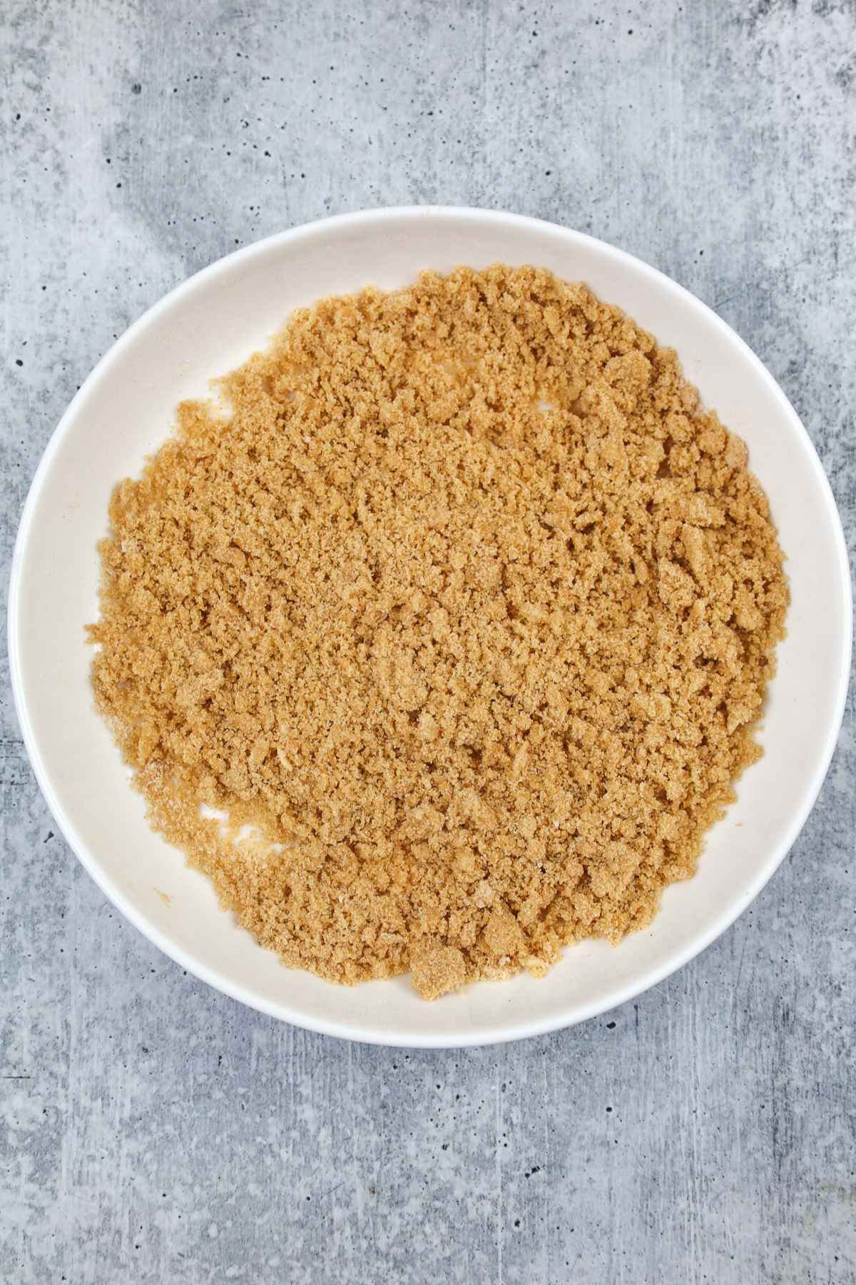 Crumble topping in a white bowl.