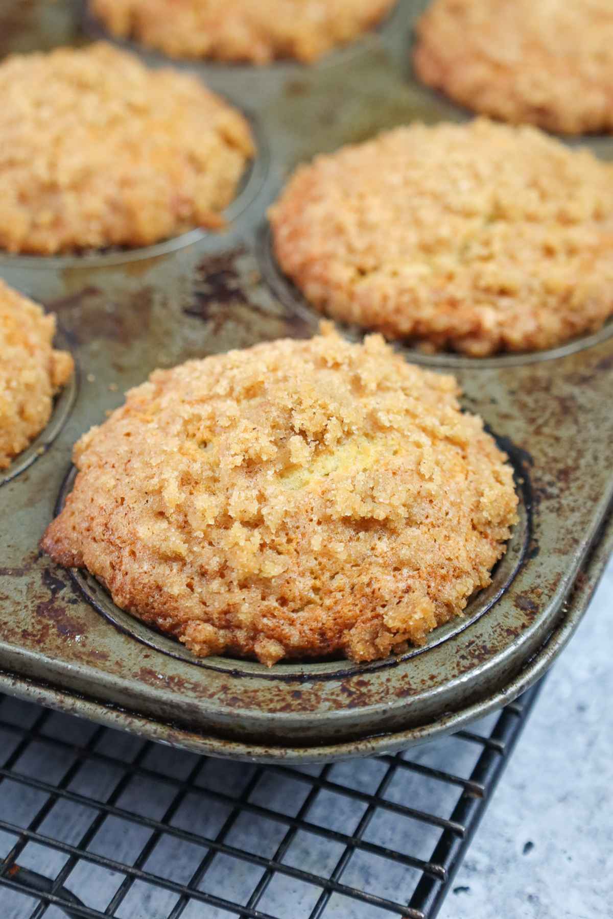 Baked banana crumb muffin in muffin pan.