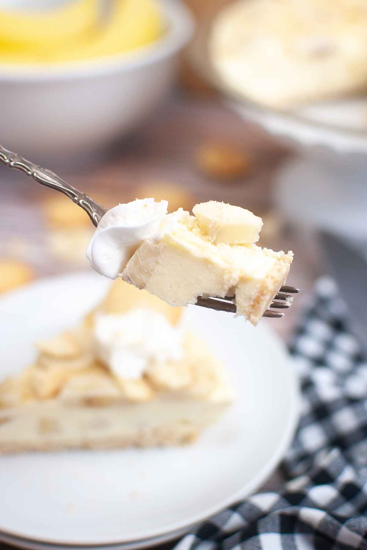 Bite shot of cheesecake on a fork.