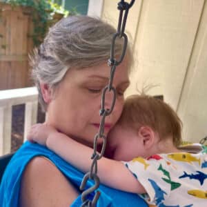 Shelby Law Ruttan with her grandson on a swing.