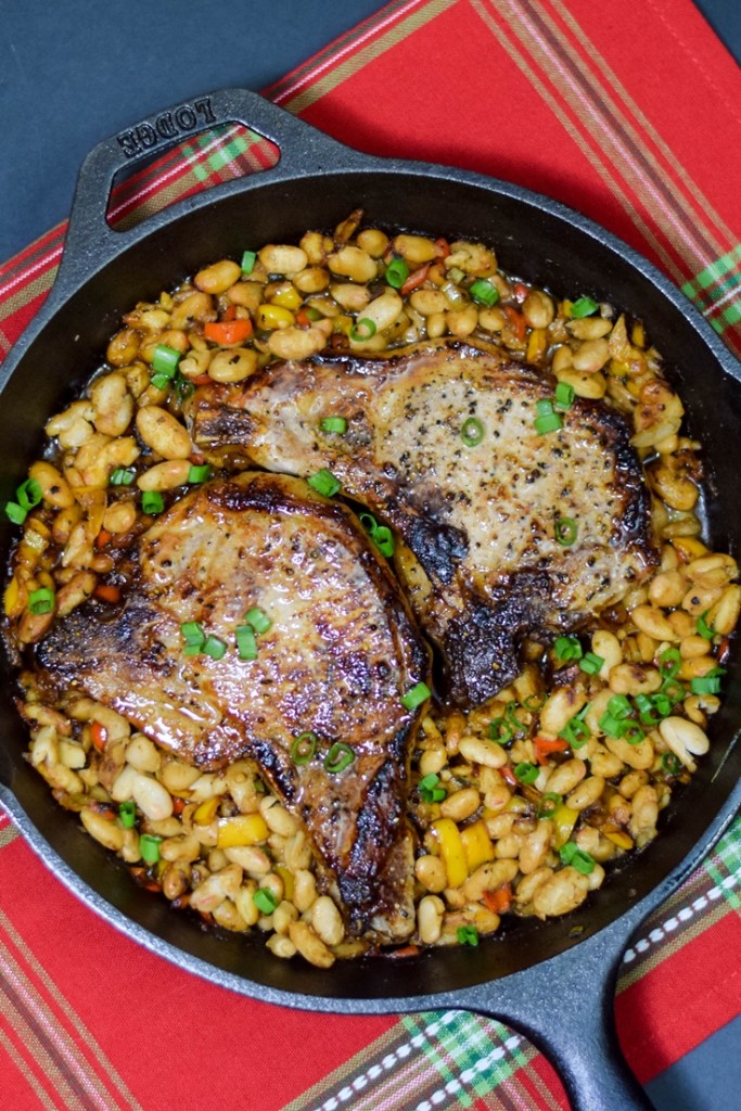 Bourbon Glazed Pork Chops in a cast iron skillet