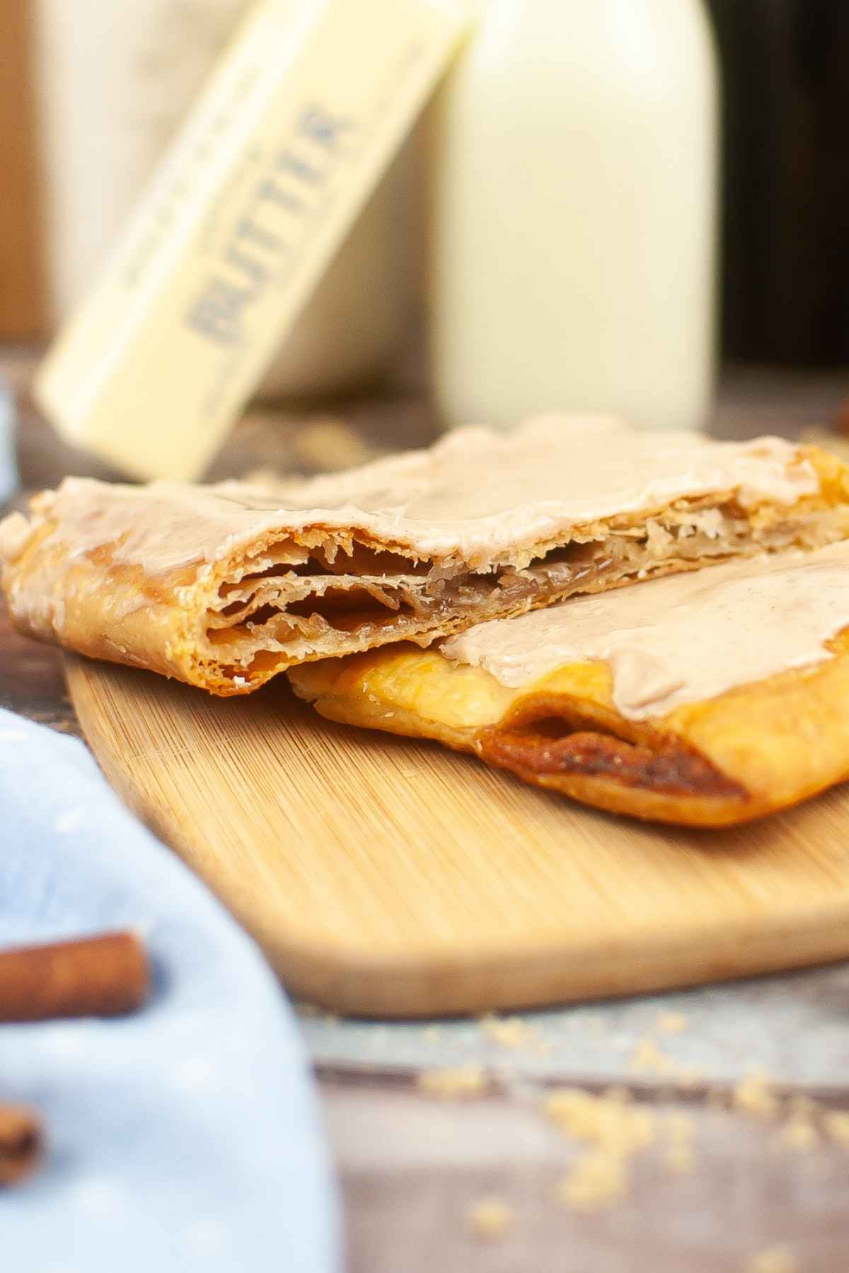 Up close image of two brown sugar cinnamon pop tarts stacked on top of each other.