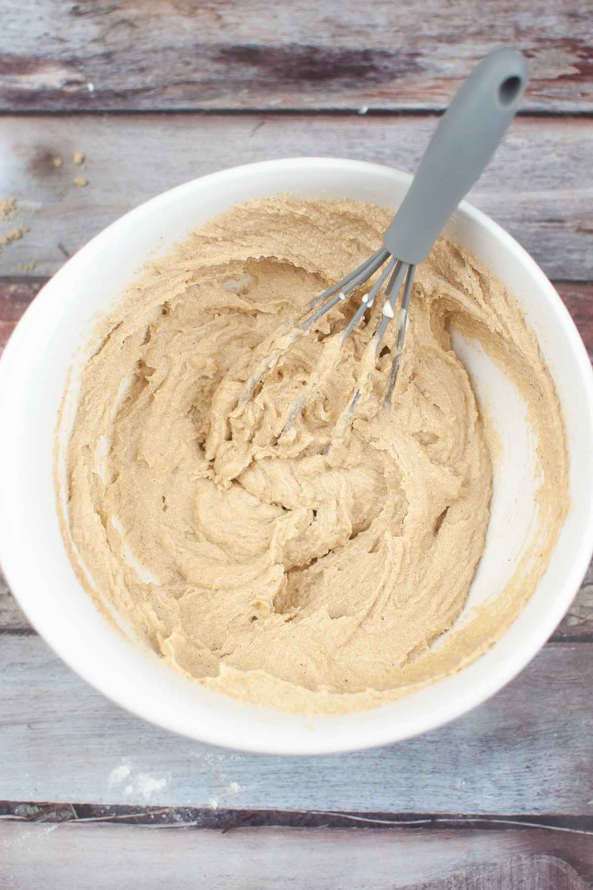 Creamed brown sugar and butter mixture in a white bowl.