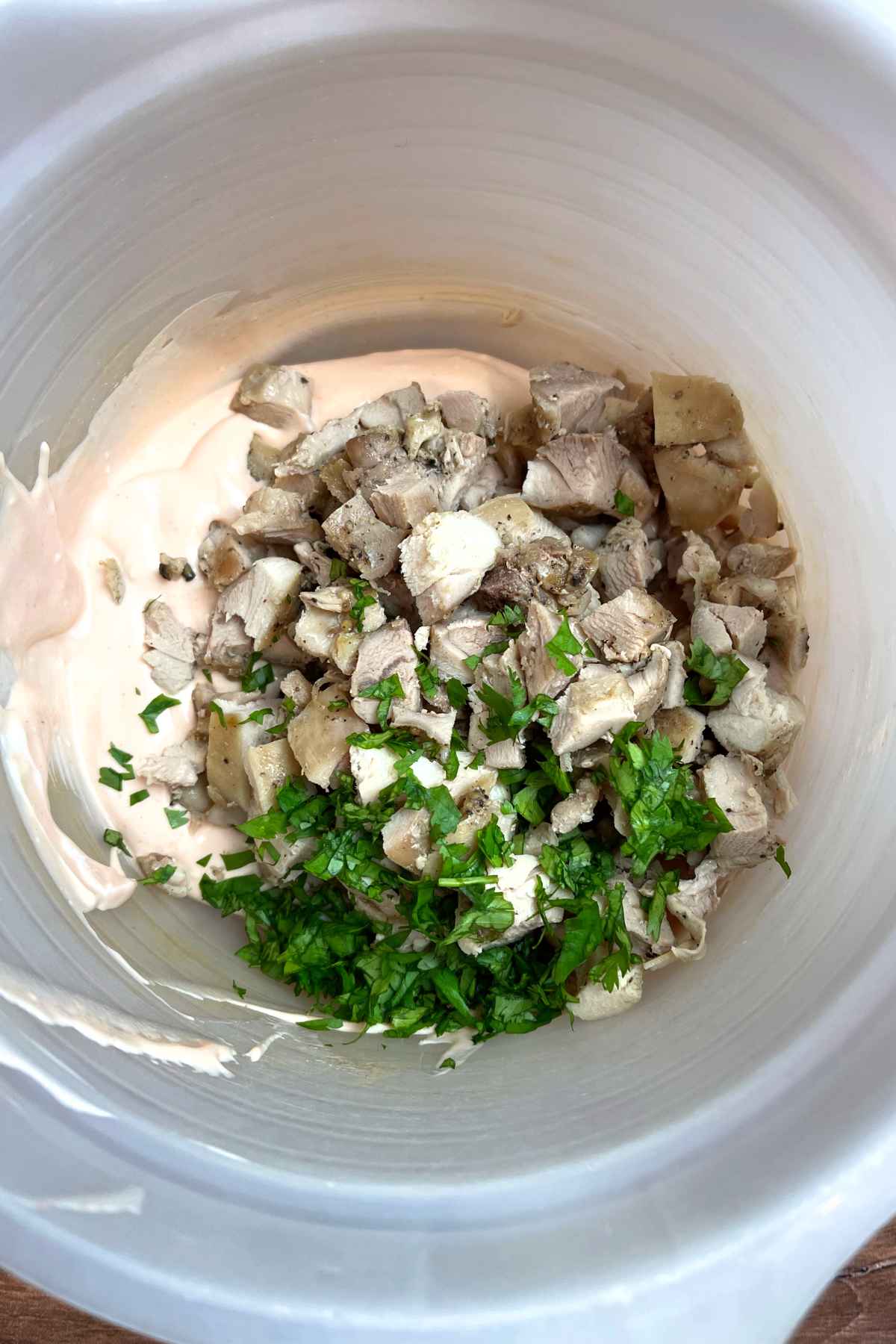 Chicken mixture in a mixing bowl.