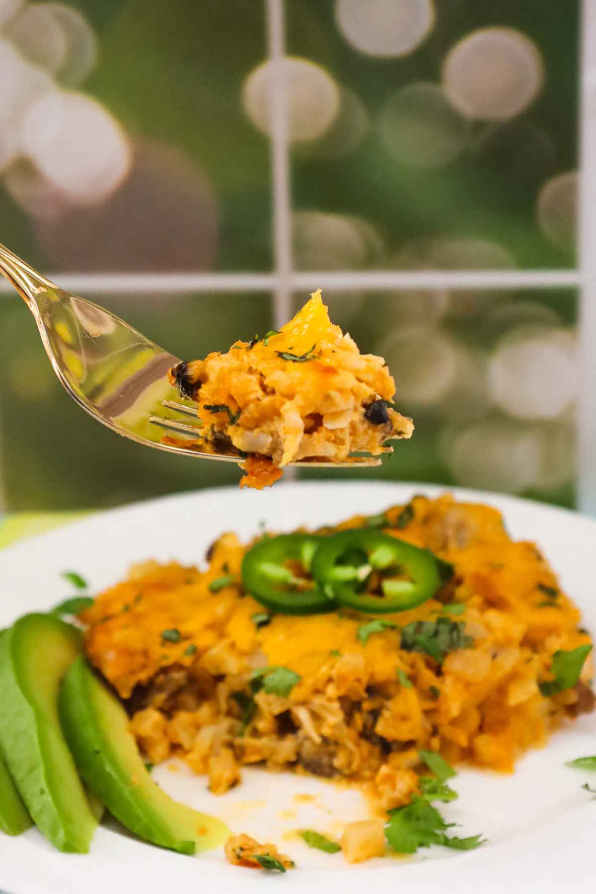 Bite shot of casserole on a fork.