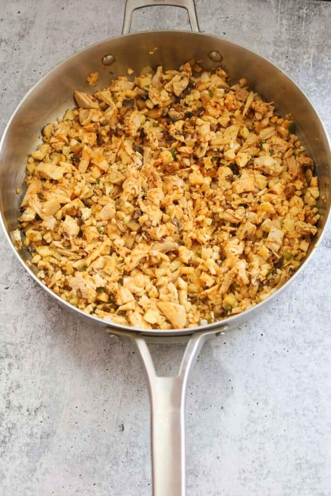 Buffalo chicken mixture in a skillet.