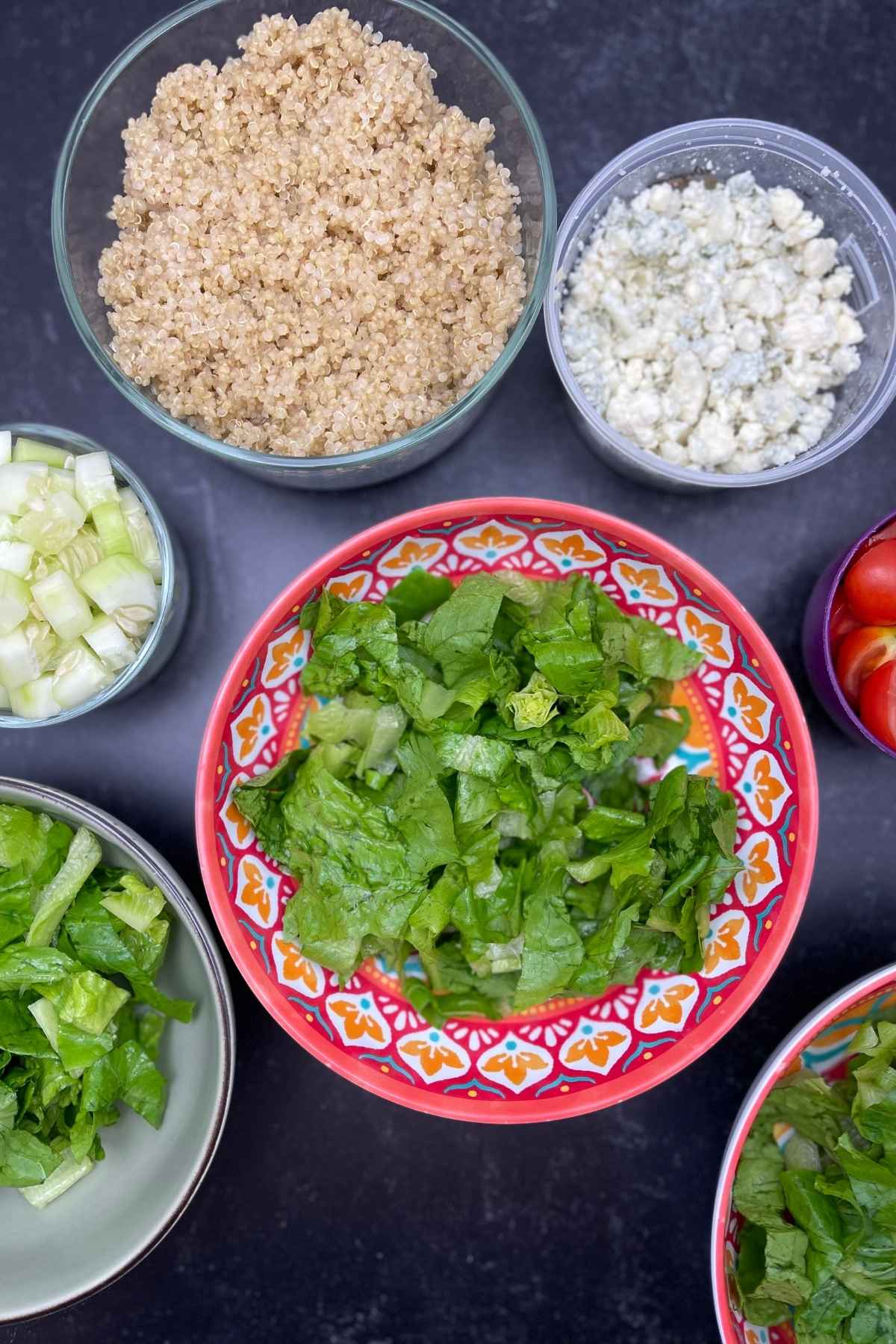 Ingredients for salad assembly Buffalo Chicken Bowl.