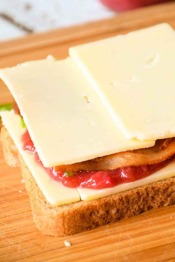 bread slice with cheese, rhubarb recipe for sauce layer, bacon, jalapeno and cheese