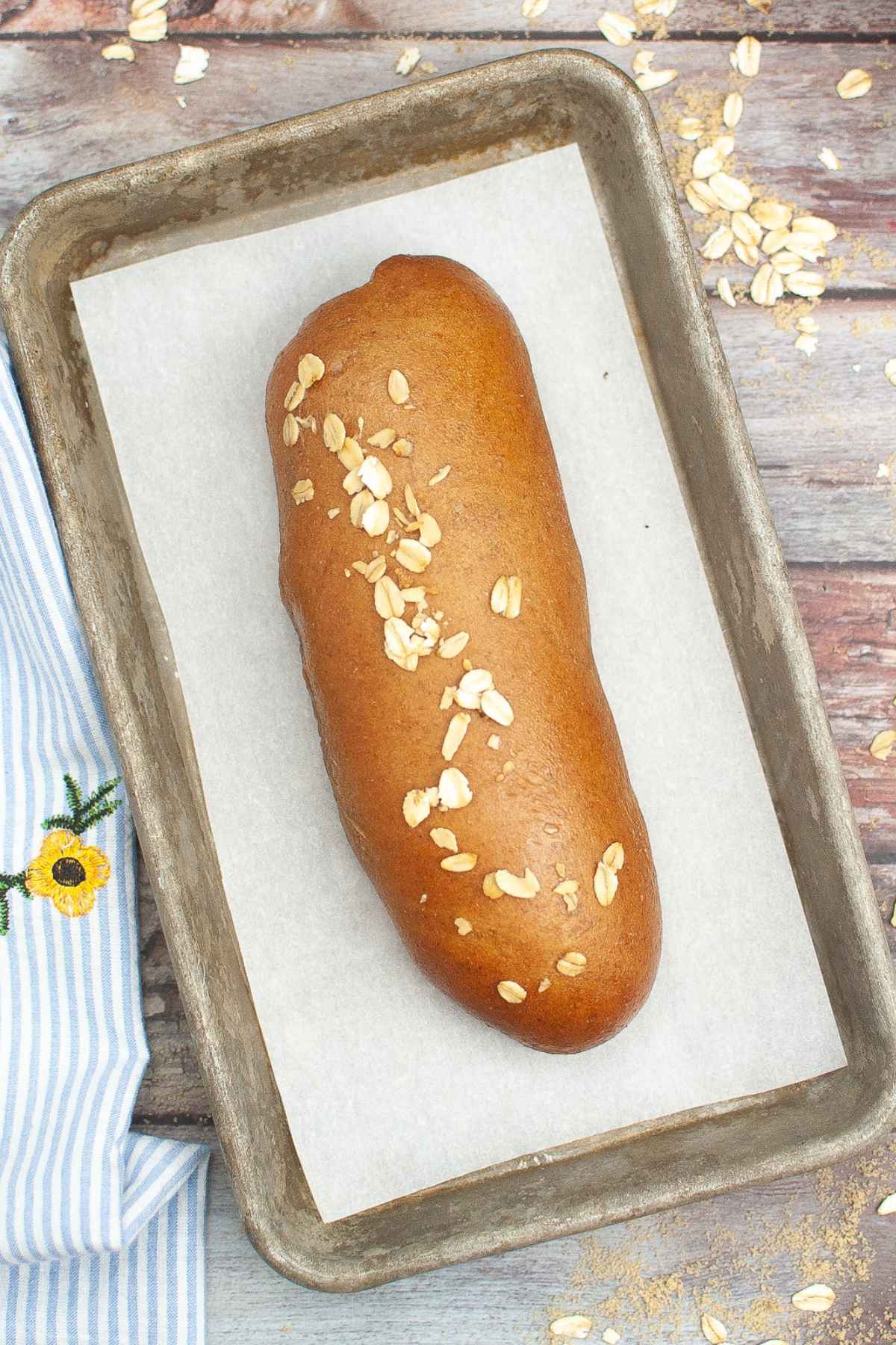 Overhead image of Cheesecake Factory Brown Bread on a parchment lined baking sheet.