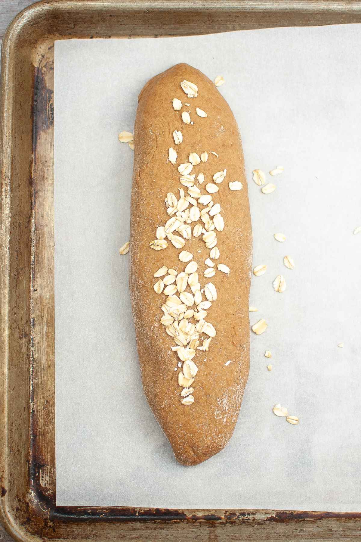 Dough on parchment lined baking sheet.