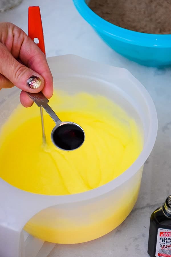 Adding vanilla extract to butter mixture.