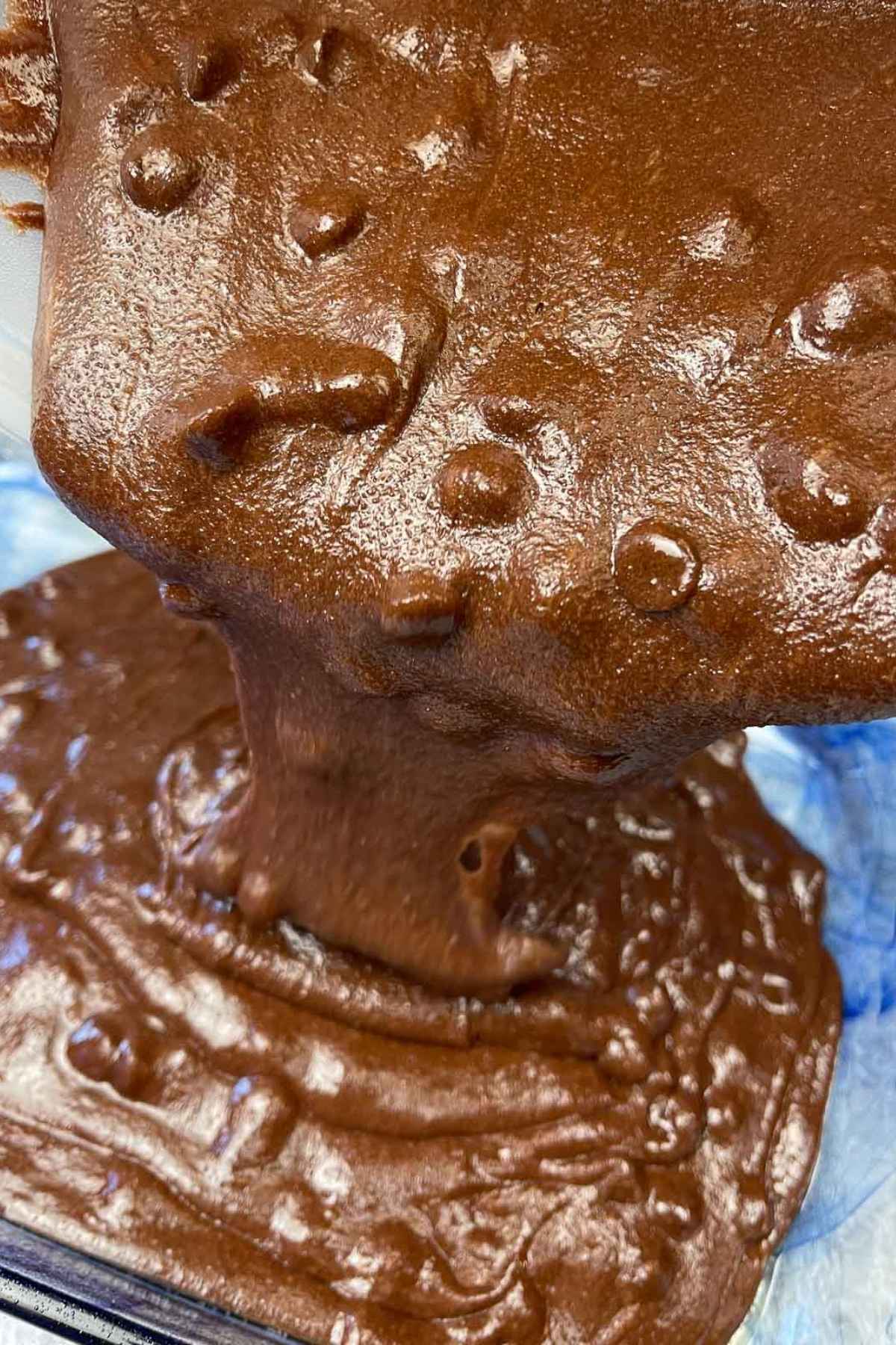 Pouring brownie batter in the baking dish.