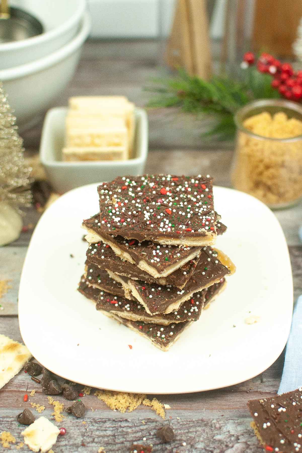 Saltine Toffee Crackers with chocolate topping and christmas sprinkles.
