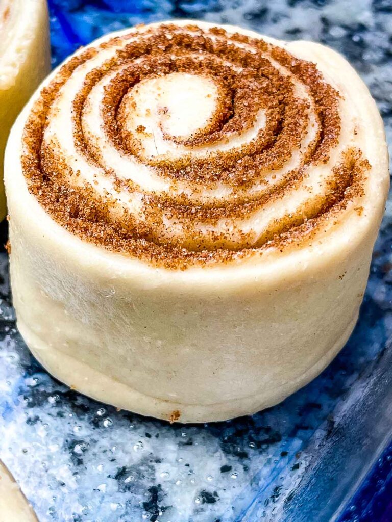 Clone of a Cinnabon unbaked cinnamon roll in baking dish.