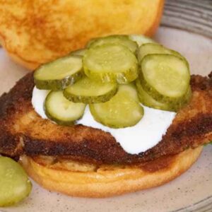 Crispy Chicken Sandwich on a bun and topped with dill pickles.