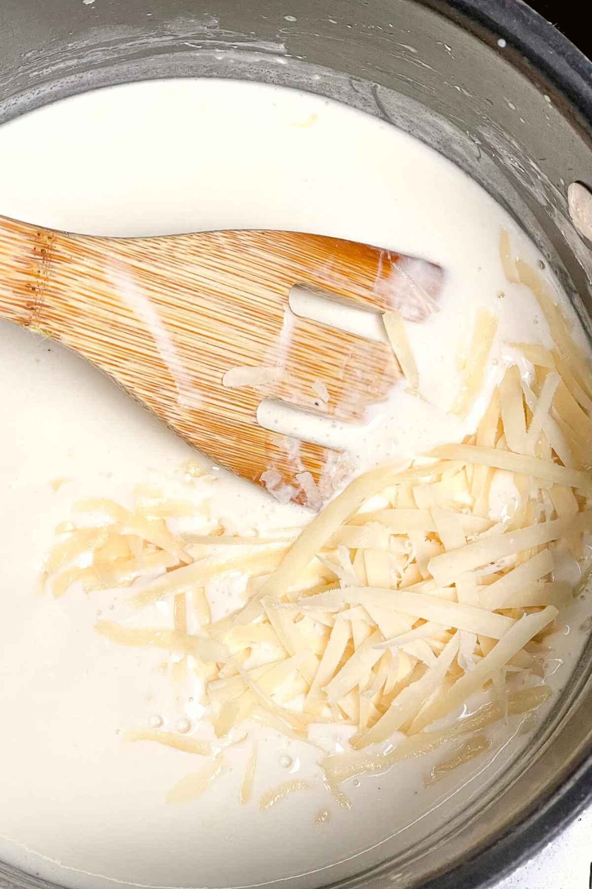 Freshly grated parmesan cheese in white sauce.