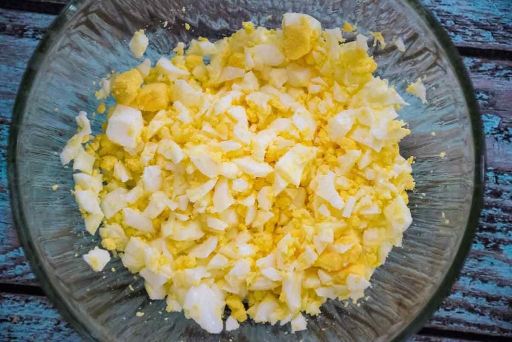 chopped hard boiled eggs in a mixing bowl