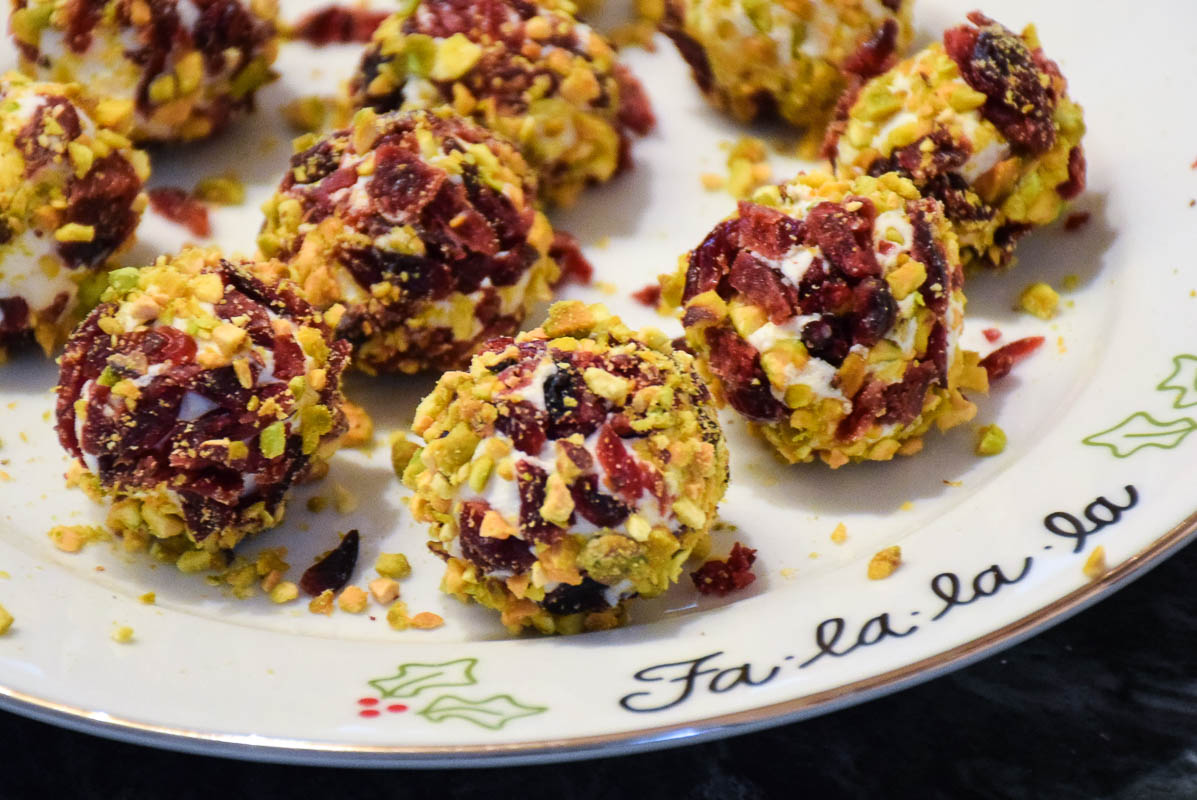 Goat cheese balls on a festive plate.