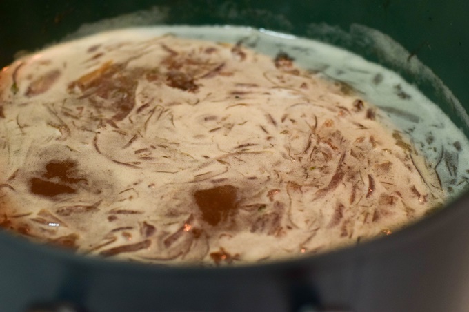 Onions simmering in beef broth.