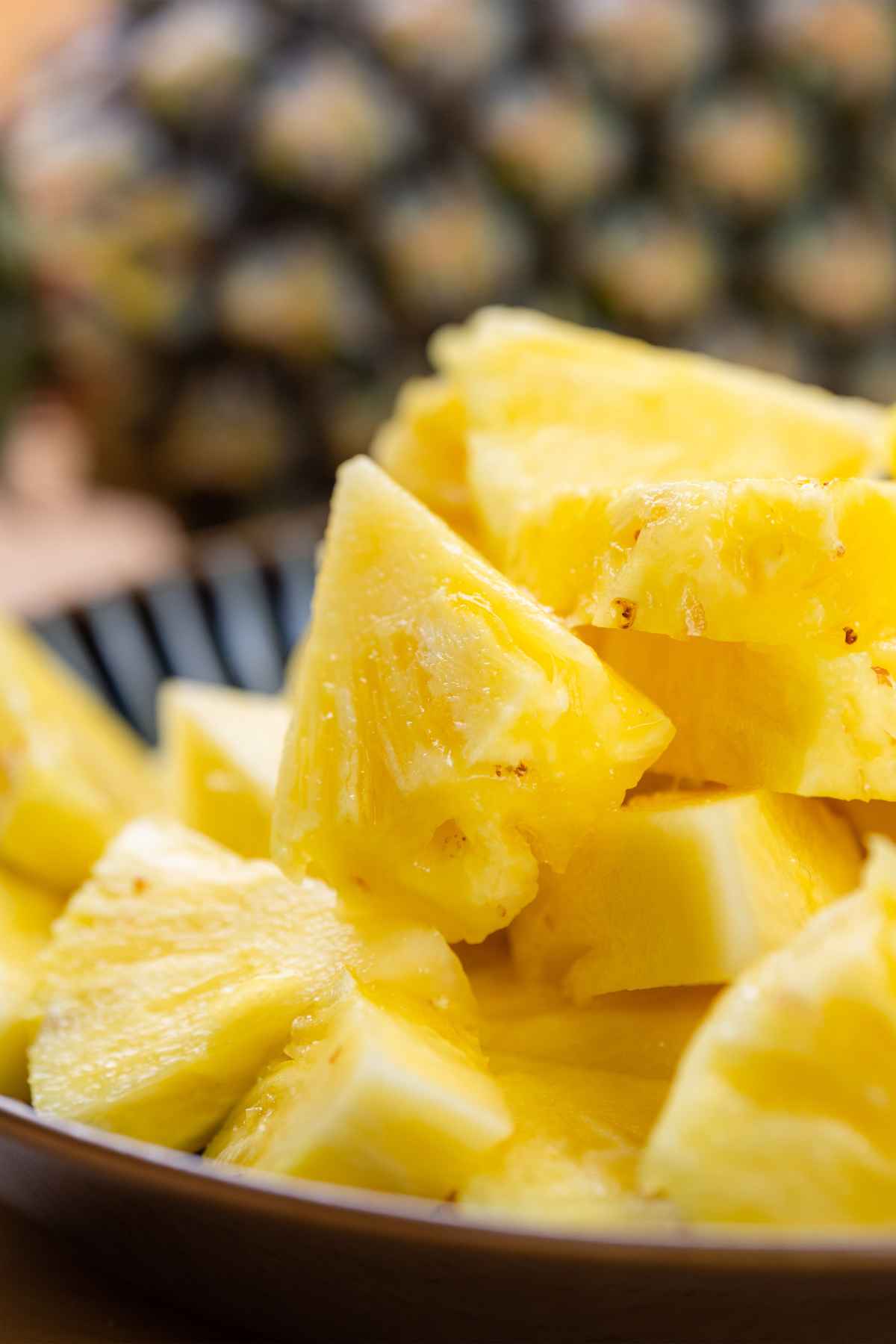 Fresh pineapple chunks in a bowl.