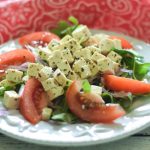 Marinated Tofu Salad Recipe on a blue plate with a red and white napkin