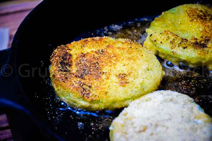 Frying green tomatoes in a skillet.