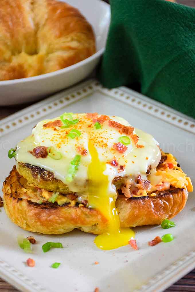 Fried Green Tomato Eggs Benedict on a cream colored plate.