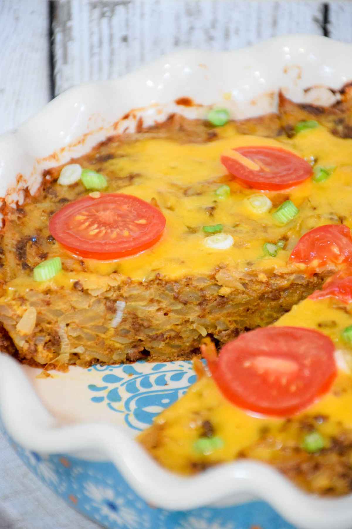 Baked casserole with a serving removed from the dish.