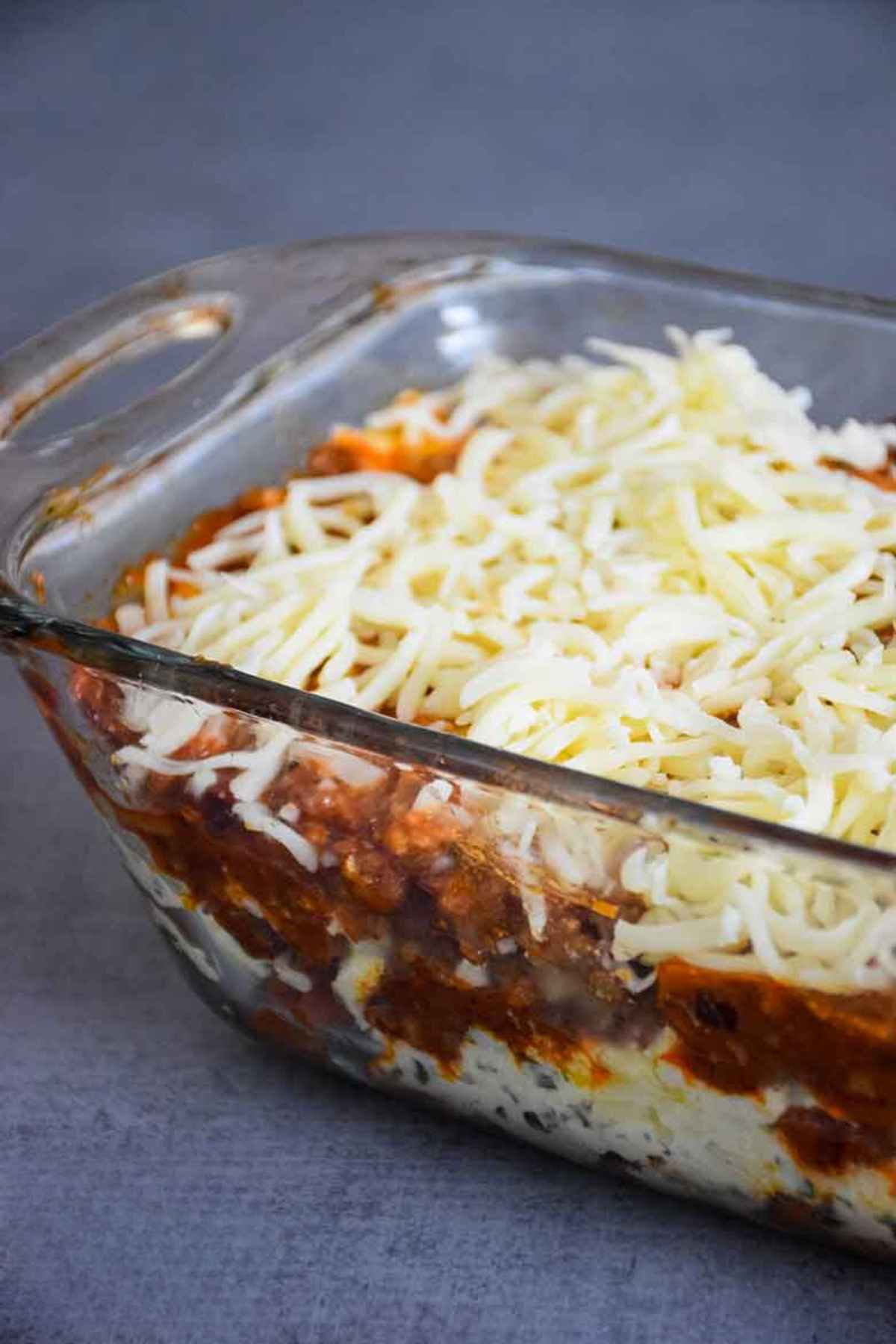 Side view of unbaked layered hearts of palm lasagna.