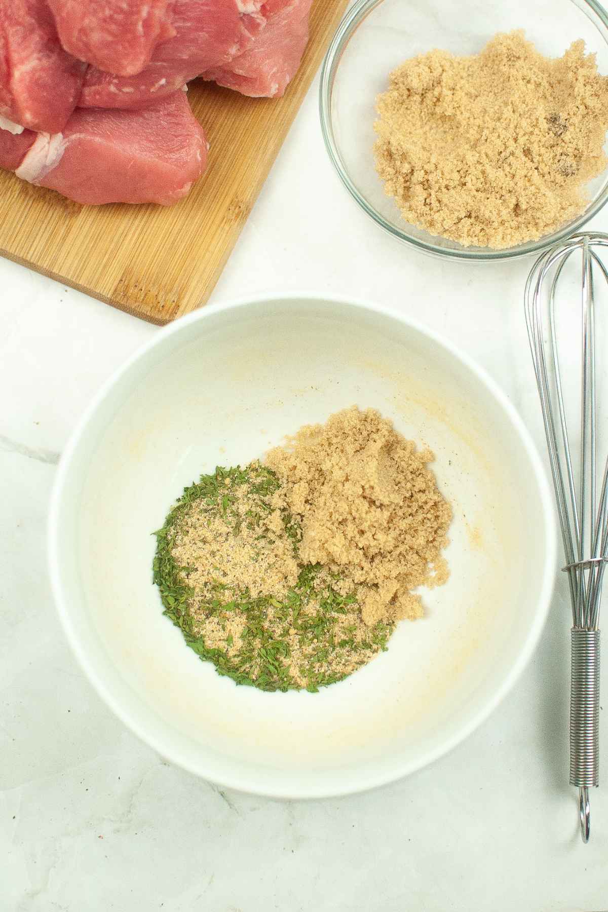 Spices and brown sugar in a mixing bowl.