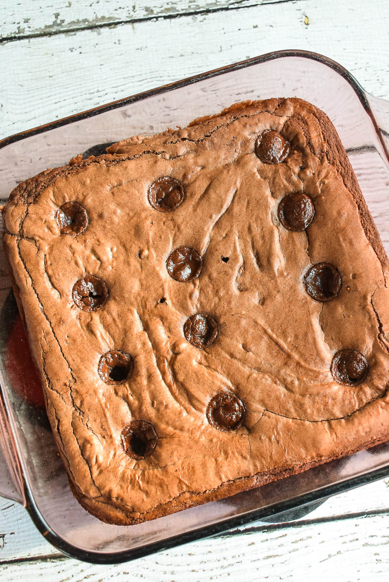 Baked brownies in a square baking pan.