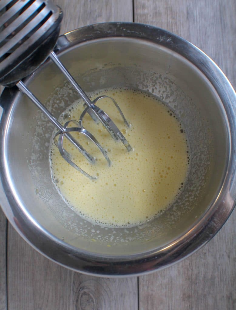 Beaten Eggs And Sugar In Mixing Bowl