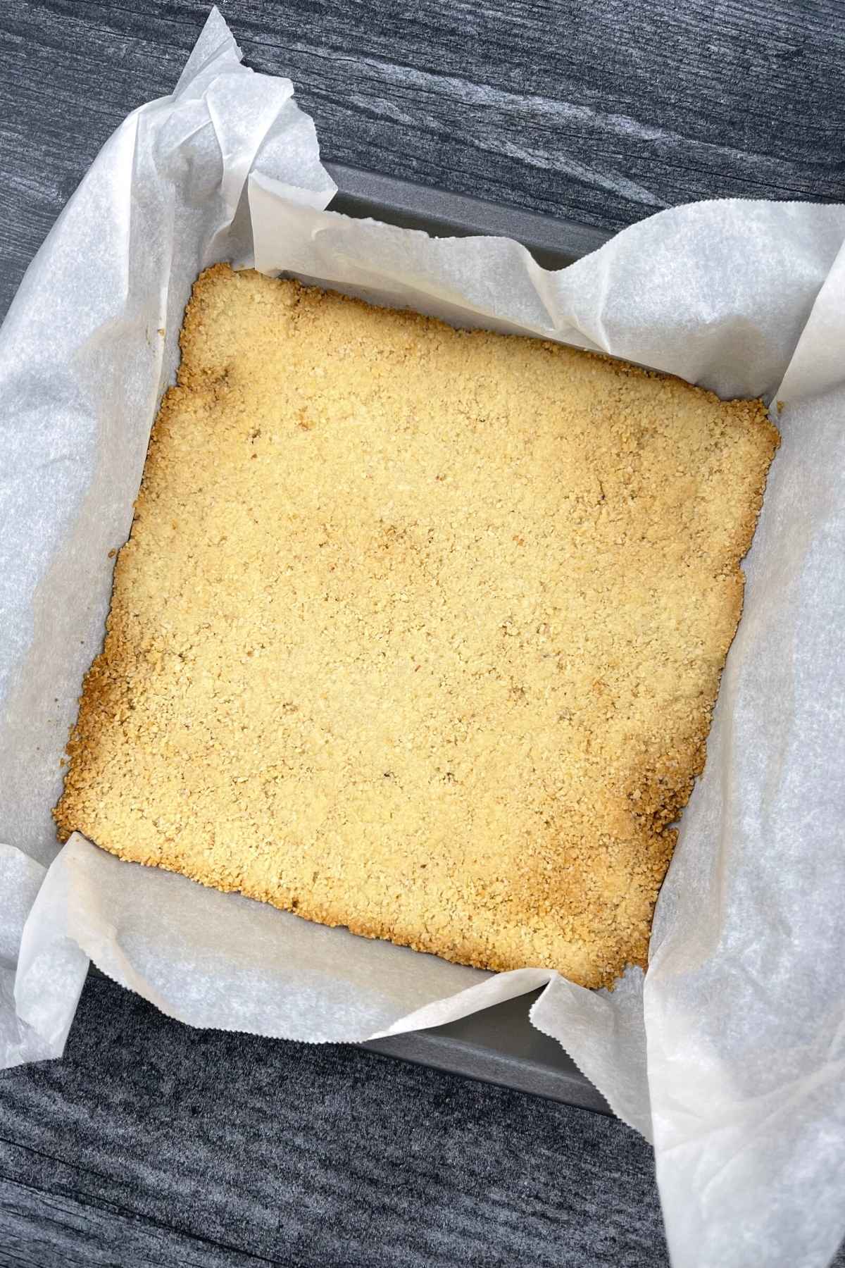 Baked crust for cheesecake bars.