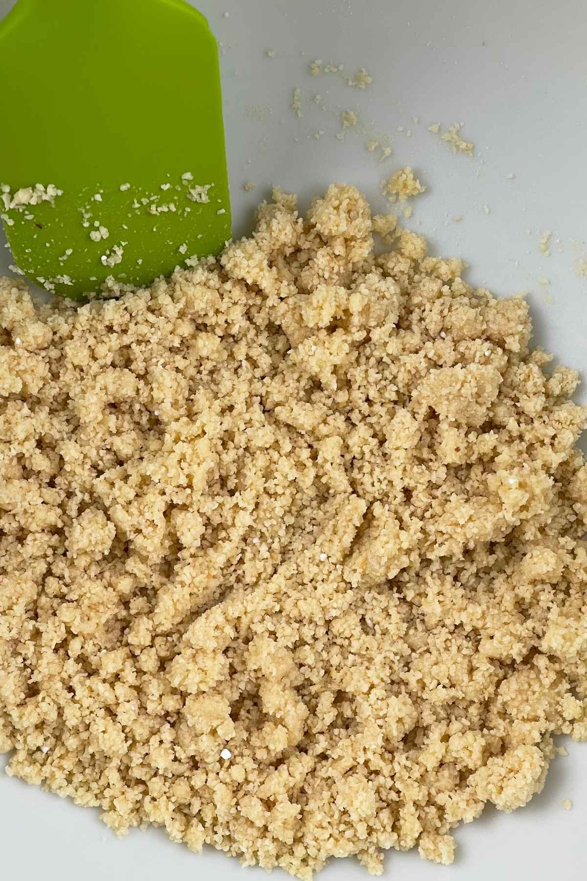 Almond flour crust in a mixing bowl.