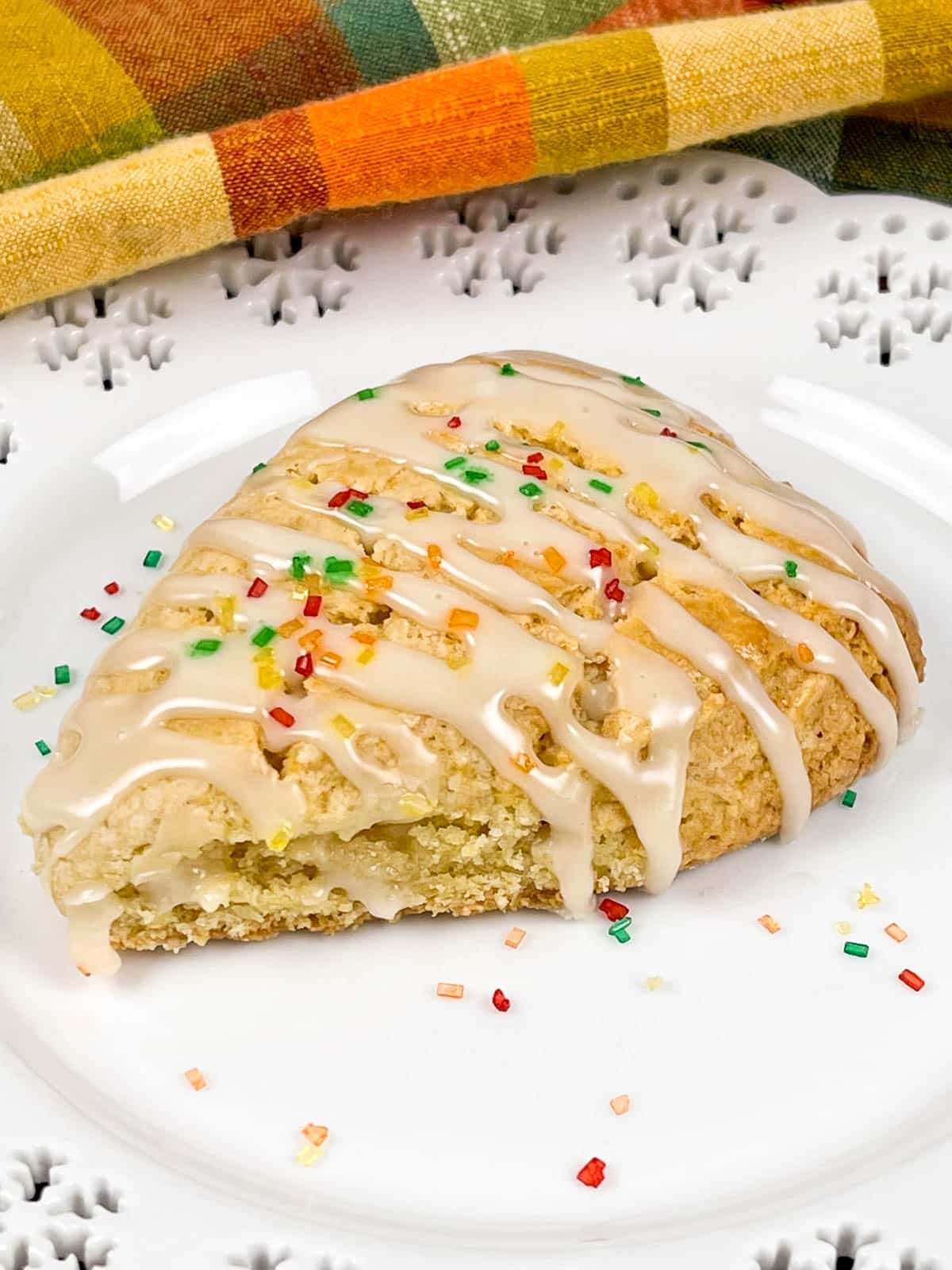 Maple Scones with Maple Frosting drizzled over top and fall colored sugar sprinkles.