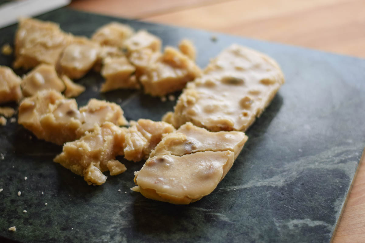 Cut maple candy on a marble board.