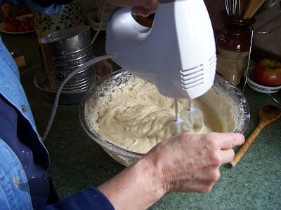 Mixing wet and dry ingredients with hand mixer.