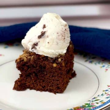 Featured image of mocha brownie with a scoop of ice cream on top.