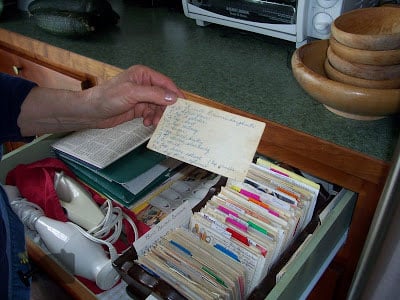 Mom holding the deep fried doughnut recipe card