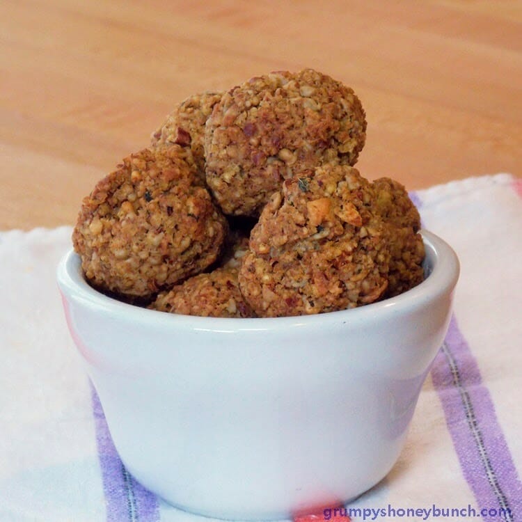 A small white bowl full of vegan meatballs.