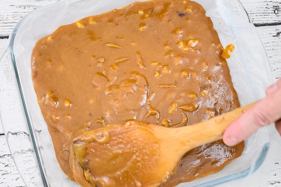 Spreading fudge out in the prepared pan.
