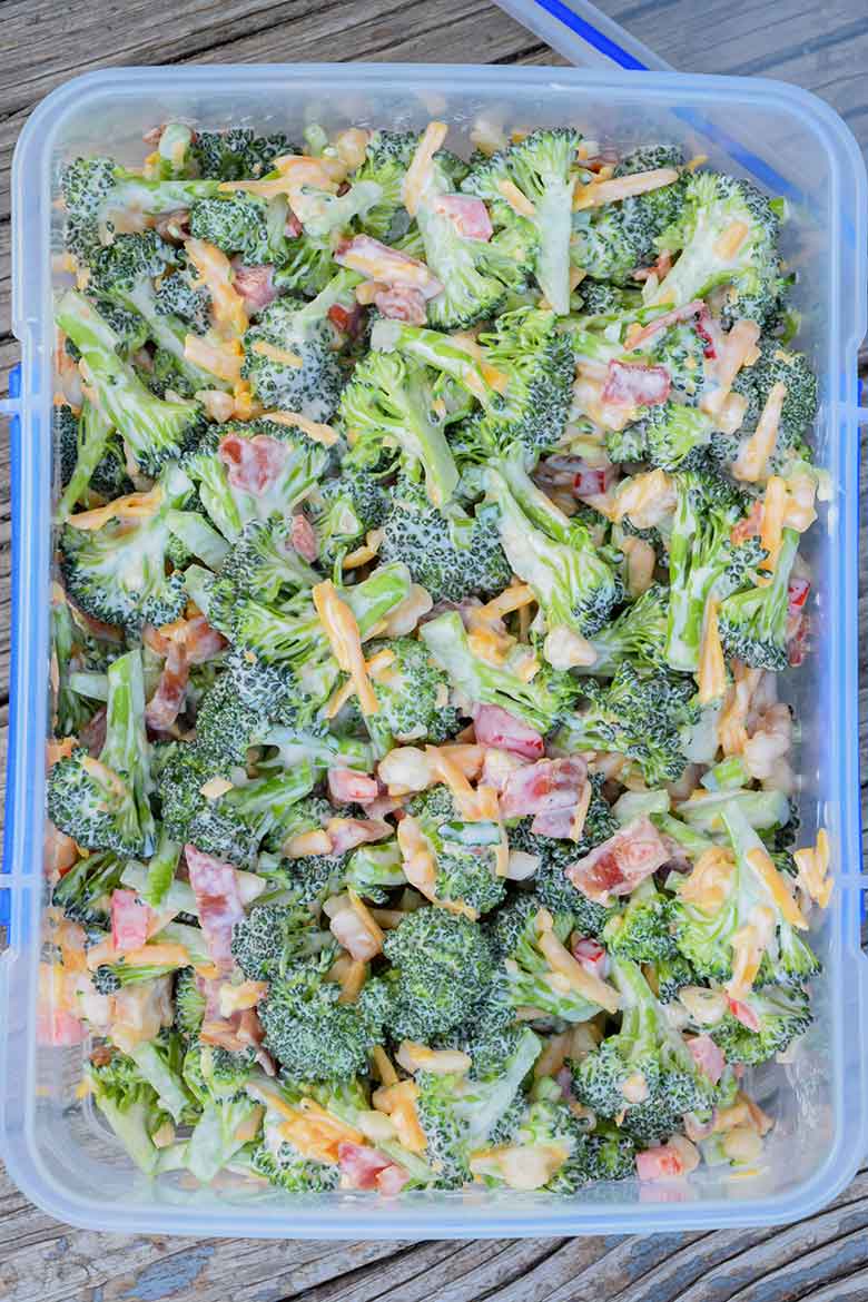 Overhead view of salad in clear storage container