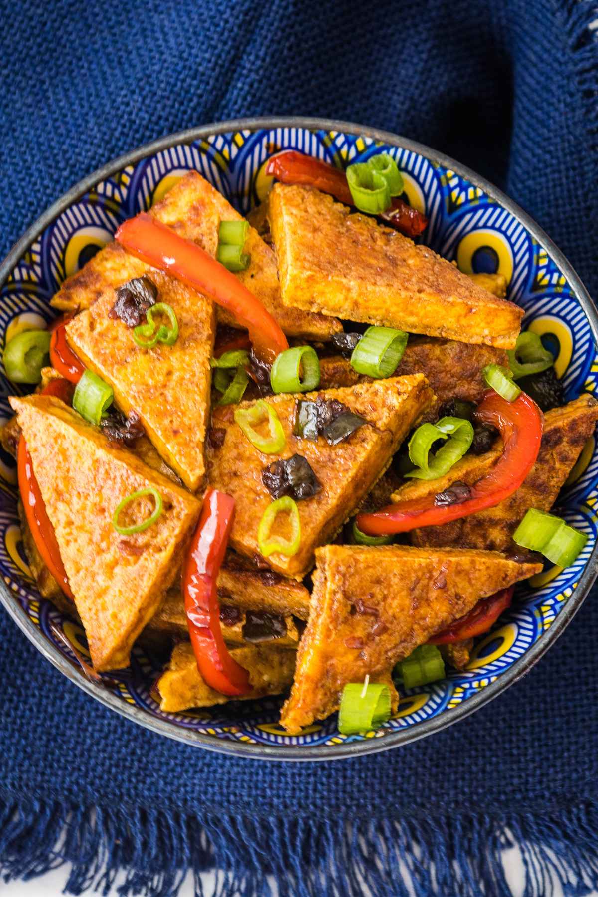 Overhead image of pan fried tofu in a serving bowl.