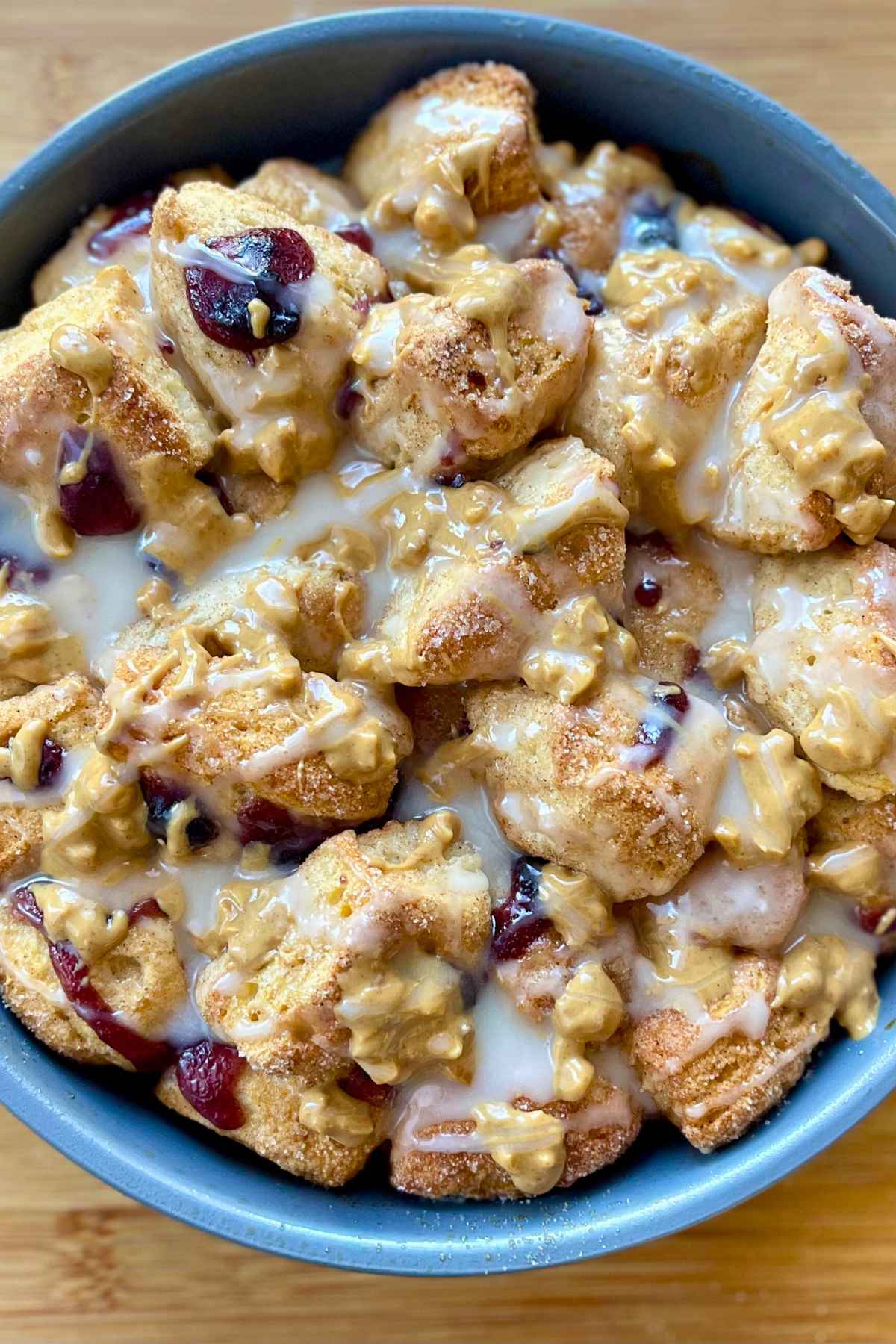 Overhead image of peanut butter and jelly monkey bread in baking dish.