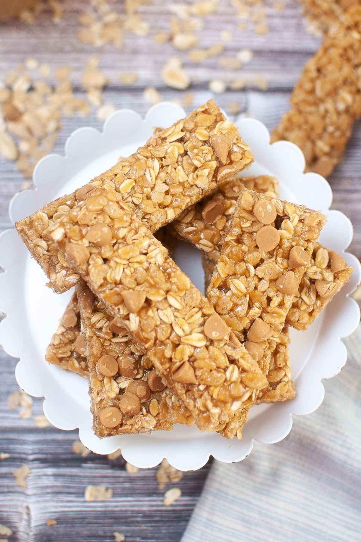 Overhead image of peanut butter granola bars on a white plate.